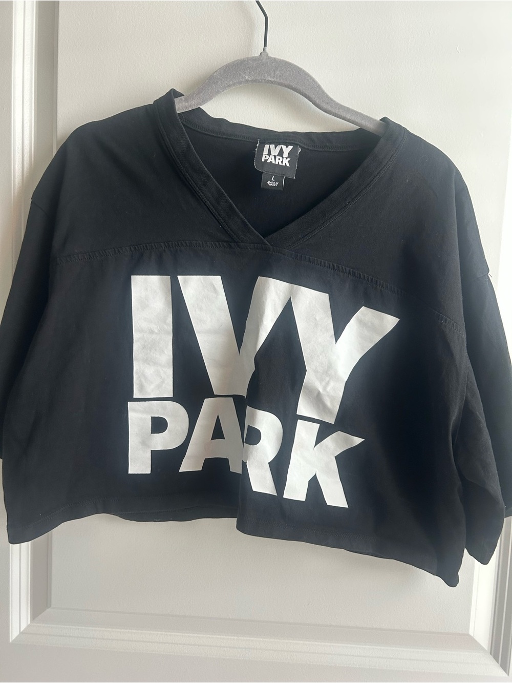 IVY PARK Black Cropped V-Neck Sweatshirt with White Logo